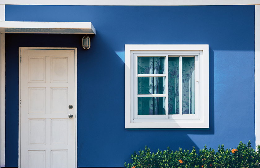 Picture of blue home with white windows